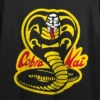 Cobra Kai Yellow And Black Cobra Women's Black 21" Cropped T-shirt -Avenue Clothing Shop GUEST a6303a15 0558 467f b995 48c3647e6d10